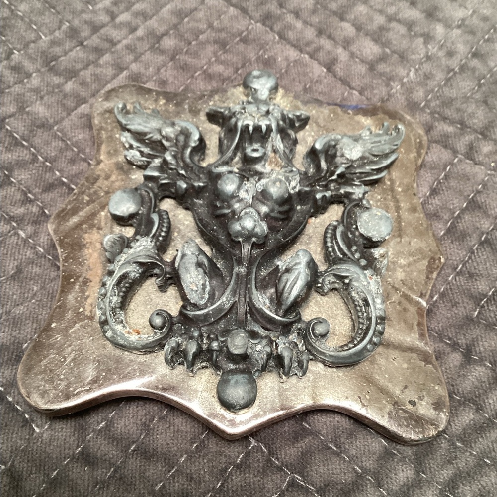 Ornate Silver and Black Decorative belt buckle, made in Italy.     107